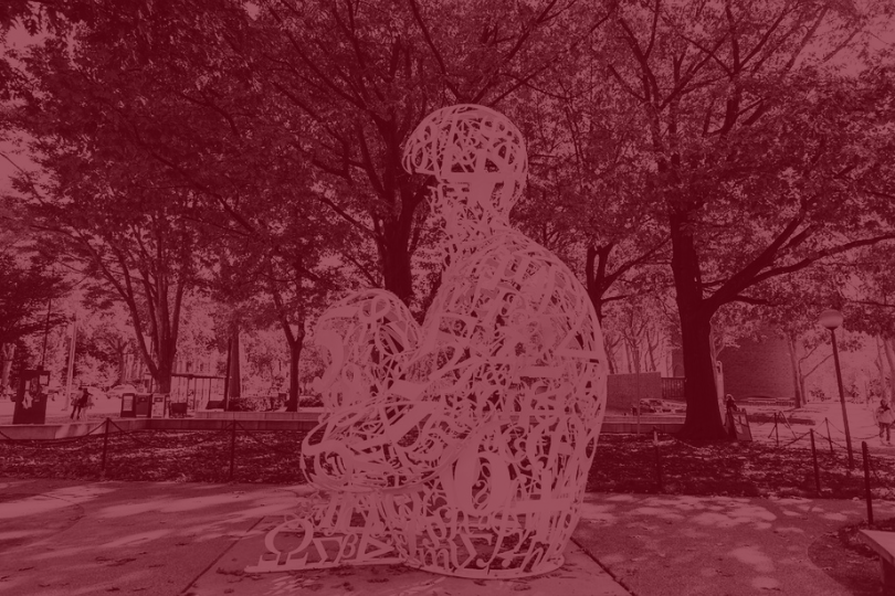 Sculpture made of stainless steel, white enamel paint featuring collages of letters, numbers, or symbols that appear to be in the process of organization.