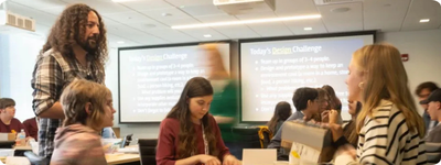Joe Diaz, program manager and STEM educator at pK-12, brainstorms with a team of students during the design thinking workshop. Photo: Mariah Rawding