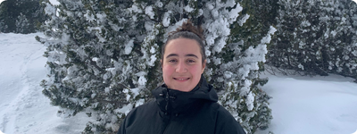 Martina Solano Soto smiling against a wintery background.