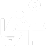 learner sitting in a chair at a desk with materials
